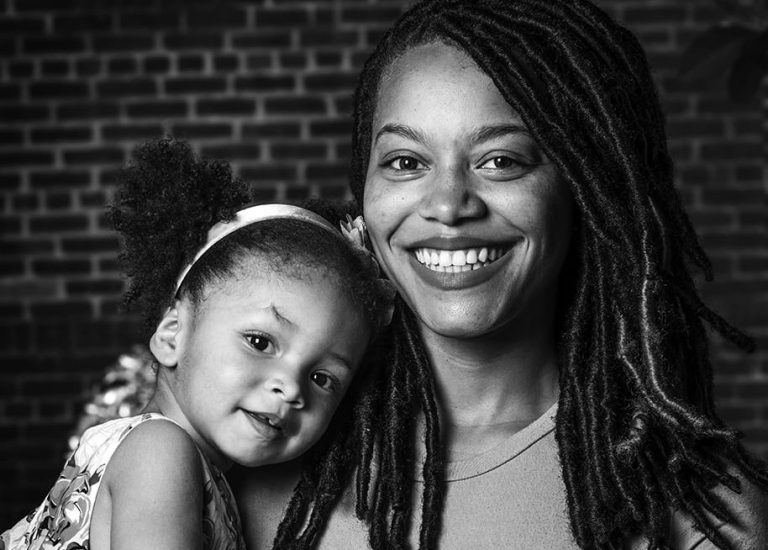 Headshot of Brianna Green and her daughter