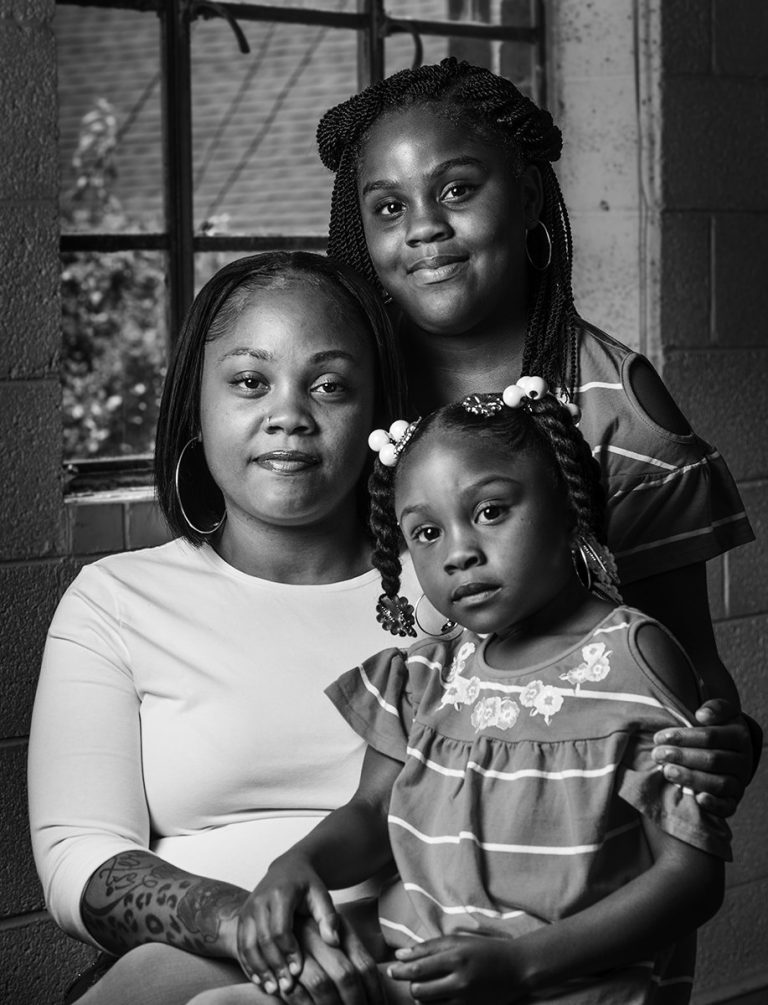 Headshot of Patricia Robinson and her daughters