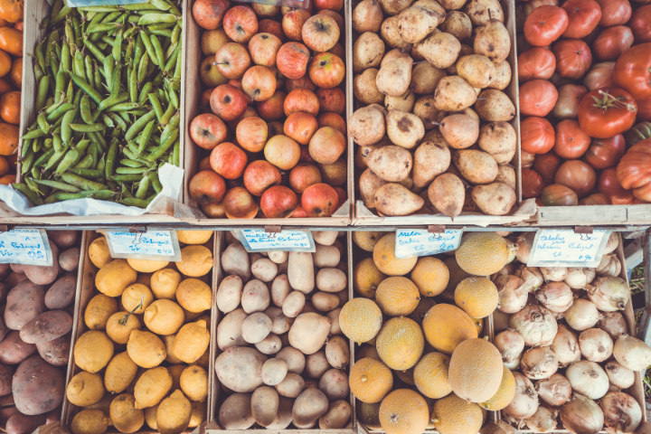 Boxes of fruit and vegetables in a grocery display