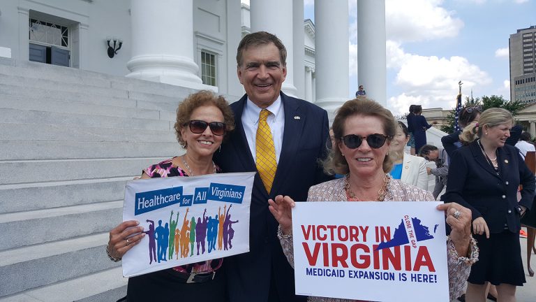 VPLC lawyers posing with signs at stairs of Virginia capitol