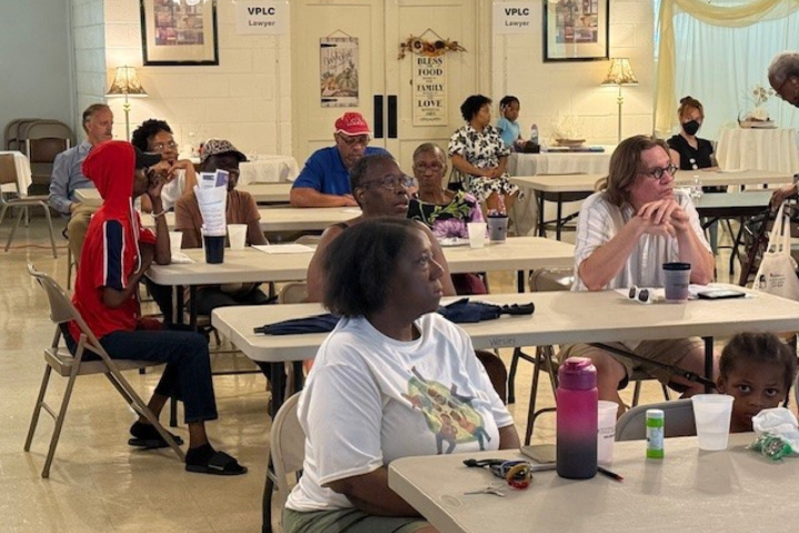 richmond residents sitting at table attending a tenant legal pop up event