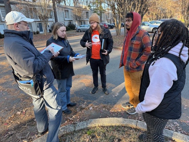 group of advocates standing in circle talking