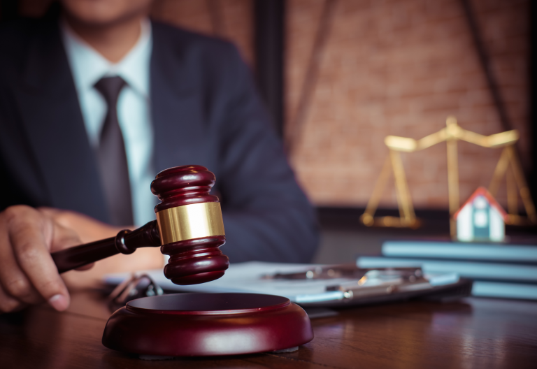 man slamming gavel