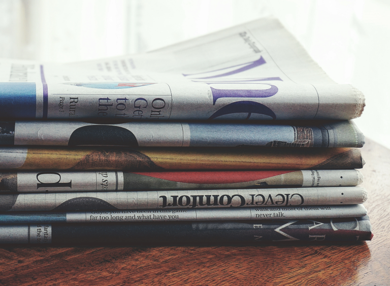 stacked newspapers