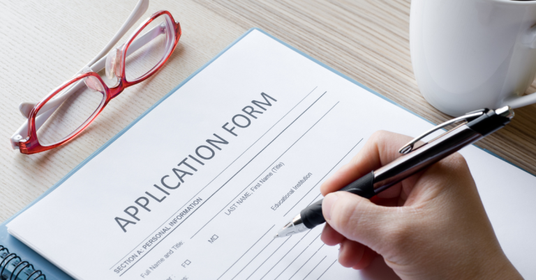 Person filling out an application form