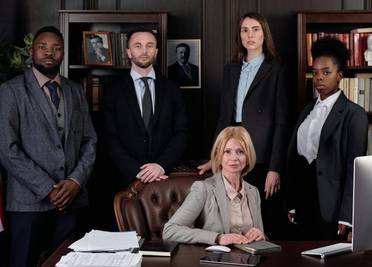 A group of attorneys in suits in an office
