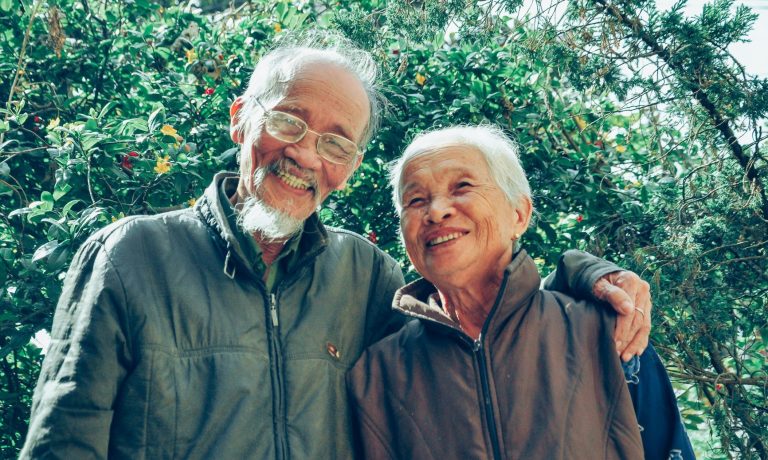 older asian couple smiling