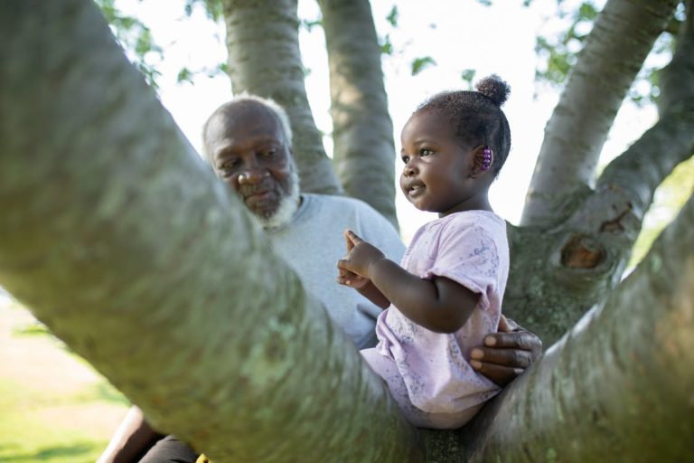 Grandfather with child in tree