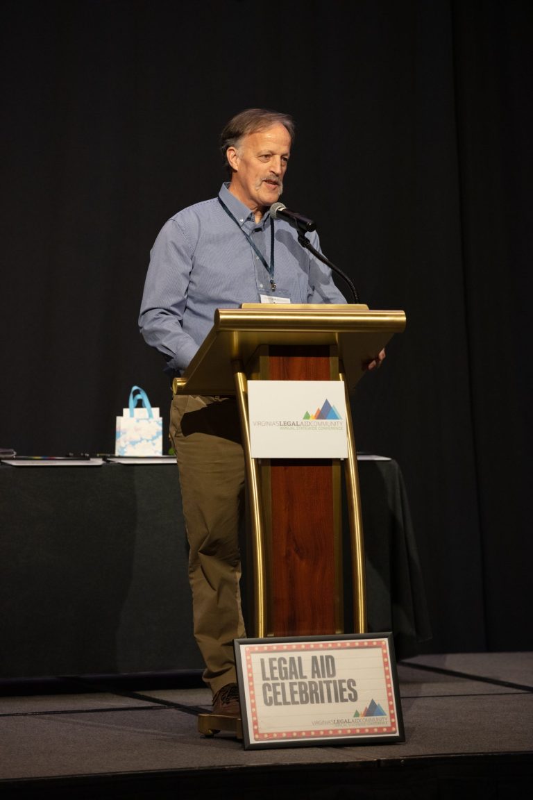 VPLC's Executive Director Jay Speer gives a speech at the legal aid awards dinner at the 2025 Annual Statewide Legal Aid Conference.