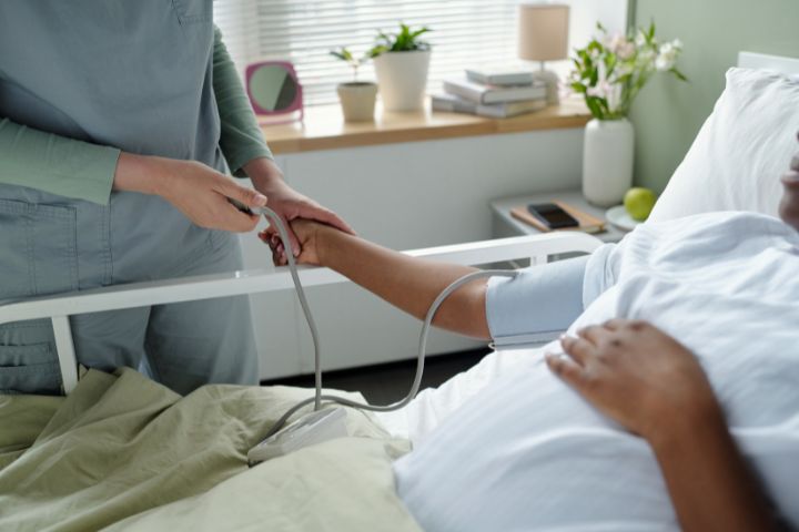 Medical professional bedside with patient