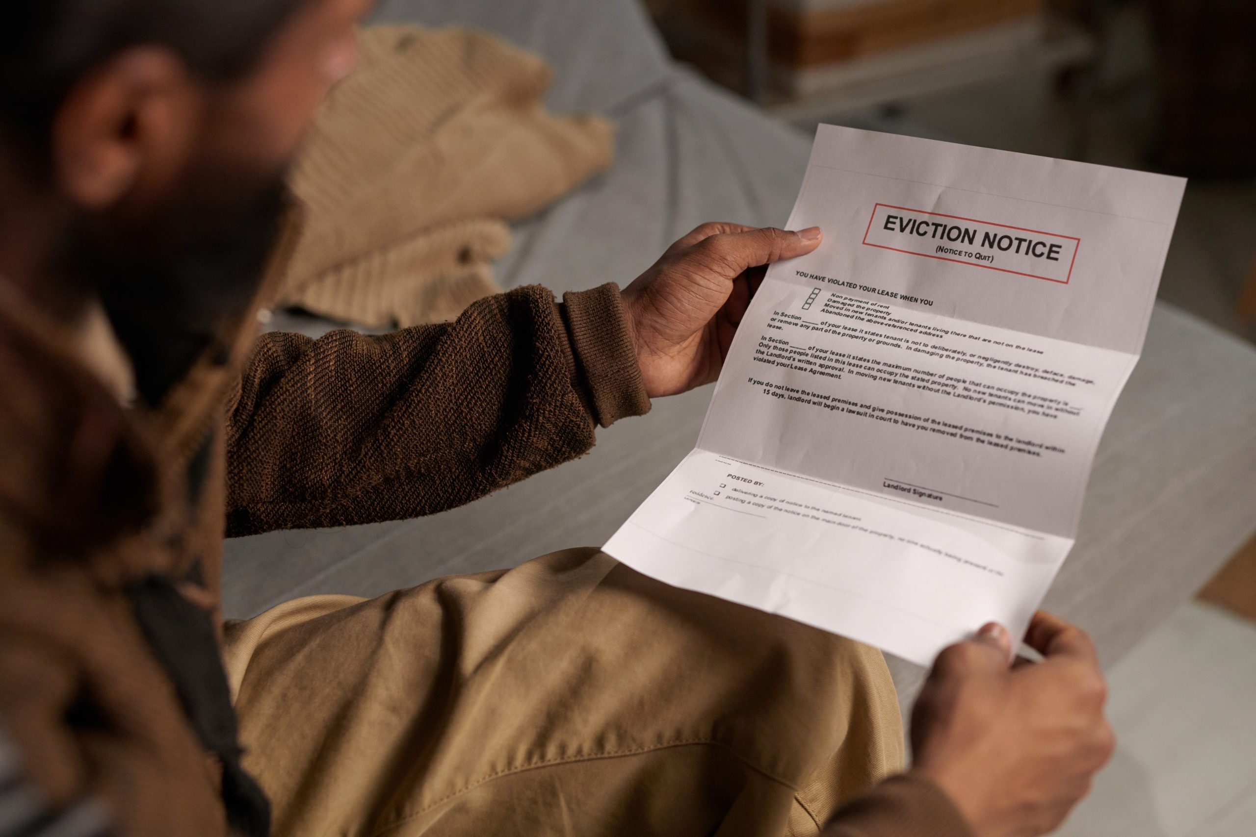 photo of man with eviction notice